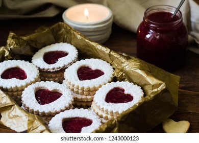 Lovely heart shaped linzer cookies with cranberry jam. Cookie on the valentine's day. Homemade baking.
Traditional Austrian christmas cookies - Linzer biscuits filled with red cranberry jam.