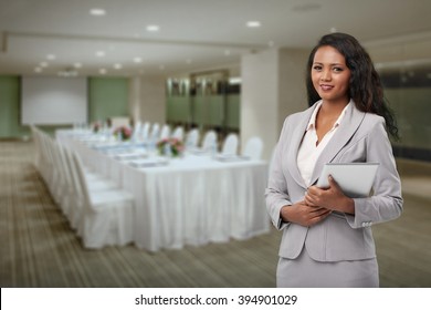 Lovely Hotel Manager Standing In Banquet Hall