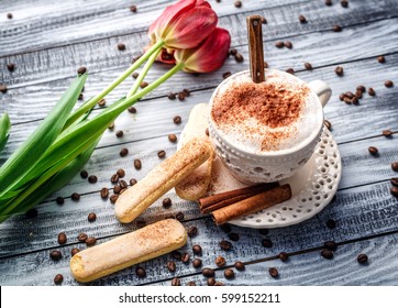 Lovely Latte Macchiato On A Wooden Background With Cookies And Cinnamon