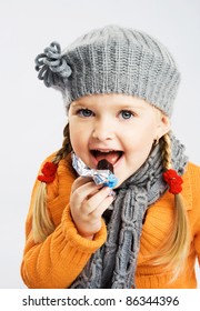 Lovely Little Girl Eating Chocolate Candy