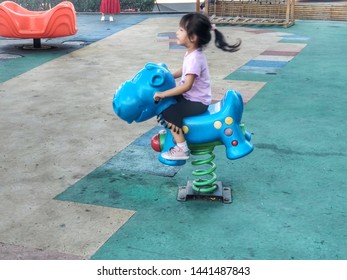 Lovely Little Girl Riding A Trojan Horse, Grandma July 1, 2019, Beijing, China