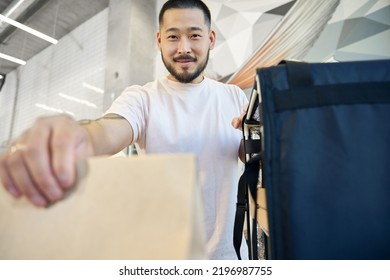 Lovely Local Cafe Employee Providing Food Delivery Service