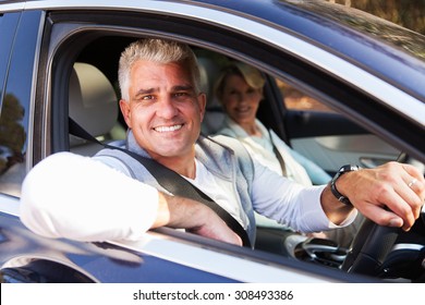 Lovely Middle Aged Couple Driving A Car