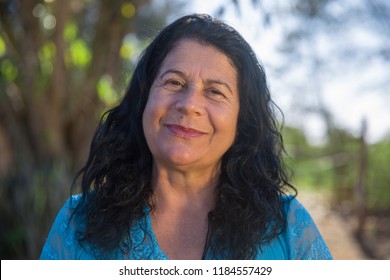 Lovely middle aged woman in the summer park - Laughing mature woman - An women smiling
