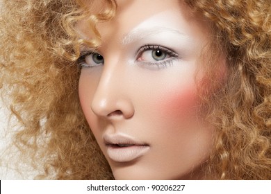 Lovely Model With Shiny Volume Curly Hair, Winter White Eyeshadows Make-up, Pale Lips And Pink Cheeks. Christmas Look With Frizzy Hairstyle