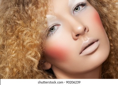 Lovely Model With Shiny Volume Curly Hair, Winter White Eyeshadows Make-up, Pale Lips And Pink Cheeks. Christmas Look With Frizzy Hairstyle