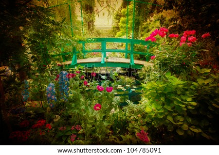 Lovely Monet type garden and bridge with artistic texture effect.