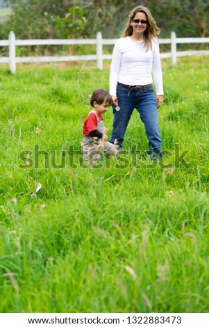 Similar – Image, Stock Photo Little girl and woman carrying basket with apples