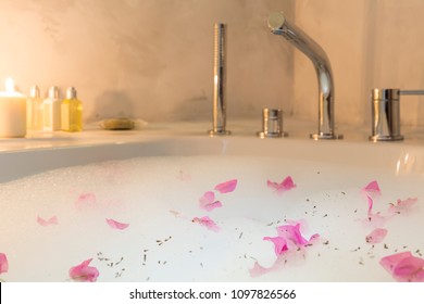 Lovely Romantic And Sexy Round Bath Full Of Foam, Rose Flowers, White Wine And Soft Candle Light Ready To Relax. Copy Space For Text Area. Honeymoon Concept For Luxury Hotel Room.