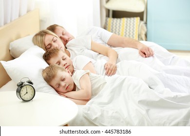 Lovely Sleeping Family In Bed