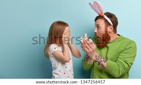 Similar – Image, Stock Photo Little girl covering eye with hand