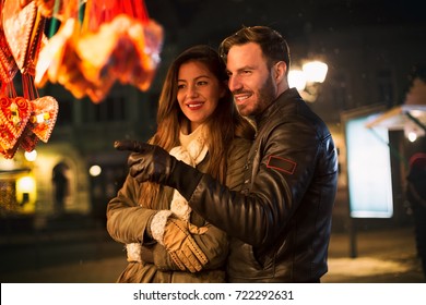 Lovely Smiling Couple Having Fun And Enjoy At Winter Night Walk