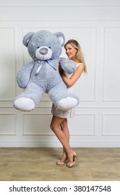 Lovely Smiling Young Woman Holding, Big Soft Teddy Bear