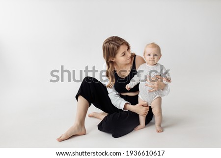 Mother giving bottle to her newborn