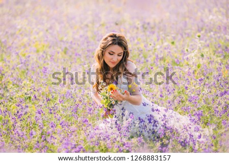 Similar – Woman posing in field of white flowers