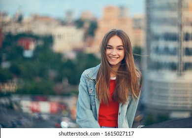 Lovely Teen Girl On Cityscape Background, Smiling At Camera