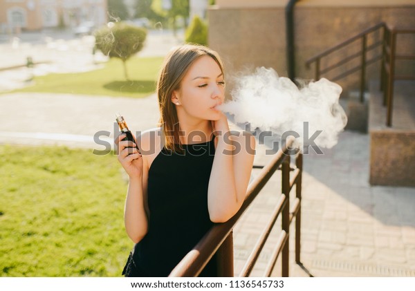 Lovely Trendy Girl Smoking Vaping Ecigarette Stock Photo Edit Now 1136545733