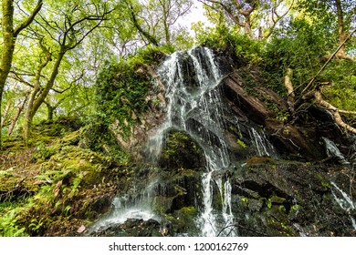 A Lovely Waterfall From Countryside Of Ireland.. The Pure Water Falling  Over Rocks,. Low Angle Shot. Very Beautiful Nature.