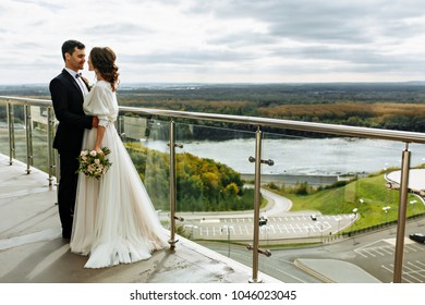 Lovely Wedding Couple Kissing In The City