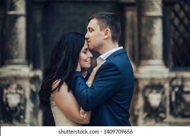 Lovely Wedding Couple Kissing In The City.