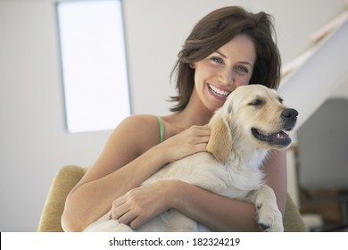 Lovely woman and dog at home