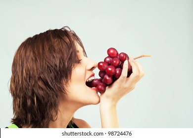 Lovely Woman Eating Grapes