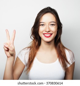 Lovely Woman Showing Victory Or Peace Sign