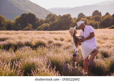 Lovely Young Couple Embracing At The Lavender Field