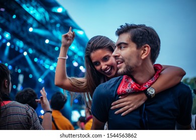 Lovely Young Couple Enjoying A Concert Together