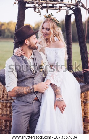 Similar – Foto Bild Eine junge blonde Boho-Frau und ein junger Mann mit einem Hirsch.