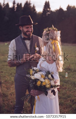 Similar – Foto Bild Eine junge blonde Boho-Frau und ein junger Mann mit einem Hirsch.