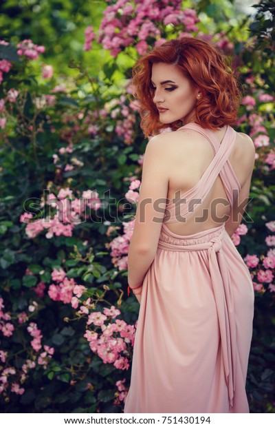 red hair pink outfit