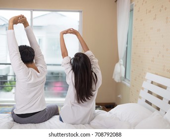 Lover Couple Stretching In Bed After Wake Up. Setup Studio Shooting.