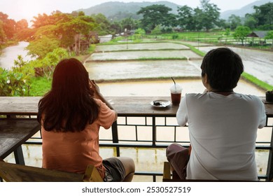 Lover to see view of rice field and mountain at the terrace of coffee restaurant with sunlight background at the morning. - Powered by Shutterstock