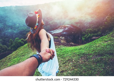 Lover women and men asians travel relax in the holiday. Hold hands running on the lawn. Wild nature wood on the mountain.  