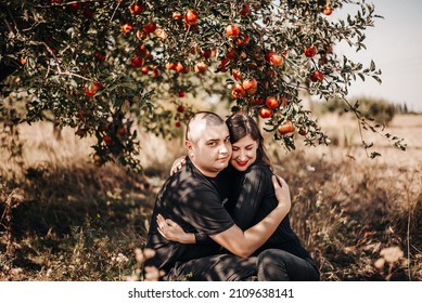 Lovers in the apple orchard 