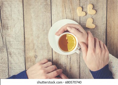 Lovers drinking tea. Selective focus. 