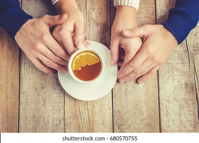 Lovers drinking tea. Selective focus. 