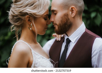lovers embrace on their wedding day