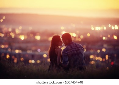 Lovers Man And Girl Against Background Night City, Sky And Horizon. Concept Date Valentine Day, First Kiss Love