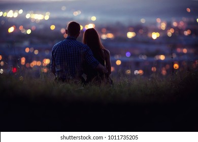 Lovers man and girl against background night city, starry sky and horizon. Concept date Valentine Day, first kiss love, forever together.