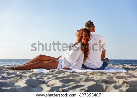 lovers on beach and hot summer time 