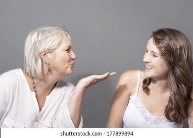 Loving Adult Daughter and mom blowing kisses - Powered by Shutterstock