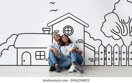 Loving African American couple planning their dream home against a hand-drawn house sketch on white wall background. Mortgage concept - Powered by Shutterstock