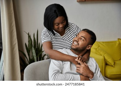 A loving African American couple shares a tender moment at home. - Powered by Shutterstock