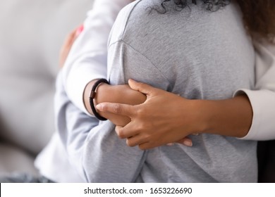 Loving African American Foster Care Parent Single Mother Sister Embrace Teen Daughter Giving Support And Protection, Black Mom Hug Teenage Girl, Family Kindness Concept, Close Up View, Focus On Hands