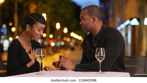 Loving African Couple Get Engaged While Out On A Nice Dinner Date