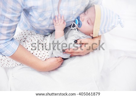 Similar – Baby asleep while parents caress