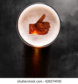 Loving Beer, Thumb Symbol On Foam In Glass On Black Table, View From Above