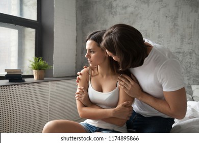 Loving boyfriend apologize before offended upset girlfriend, caring husband ask for forgiveness from stubborn wife, lover making peace after quarrel, man caress try to save relationship after cheating